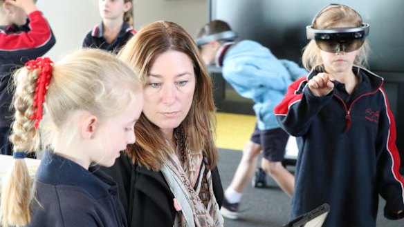 Education Minister Yvette Berry (centre) visits students at the first of the two STEM hubs, based at Caroline Chisholm School.