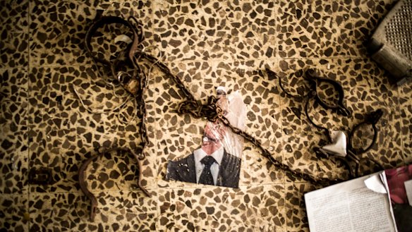 A defaced picture of Syrian President Bashar al-Assad at the Idlib central prison.