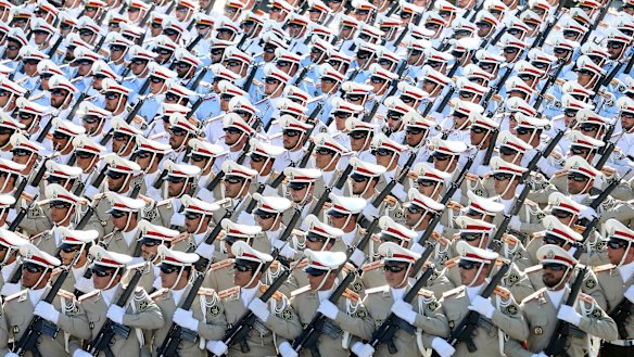 Iranian armed forces members march in a military parade marking the 36th anniversary of Iraq's 1980 invasion of Iran, just outside Tehran, Iran.