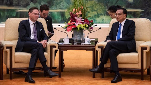 European Commission Vice President Jyrki Katainen (left) attends a meeting with China's Premier Li Keqiang in Beijing.