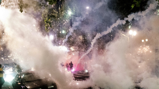 Smoke fills the sky as federal officers try to disperse Black Lives Matter protesters in Portland, Oregon. 