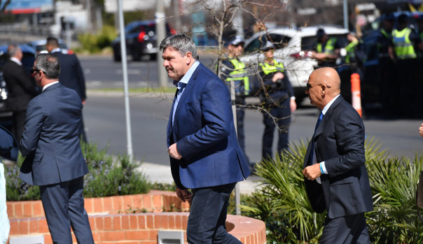 Brian Taylor arrives at Danny Frawley's funeral.