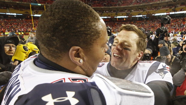The bodyguard: Brady embraces left tackle Trent Brown  after the victory over Kansas in the AFC Championship match.