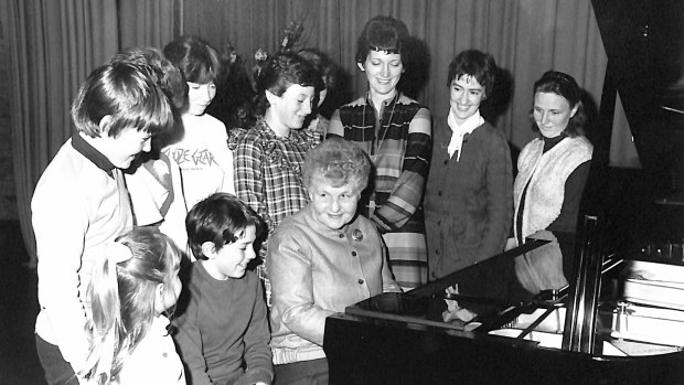 Pianist Judy Hall, at piano, and pupil Timothy Young, far left, age 11, at a Melbourne summer music school in 1981.