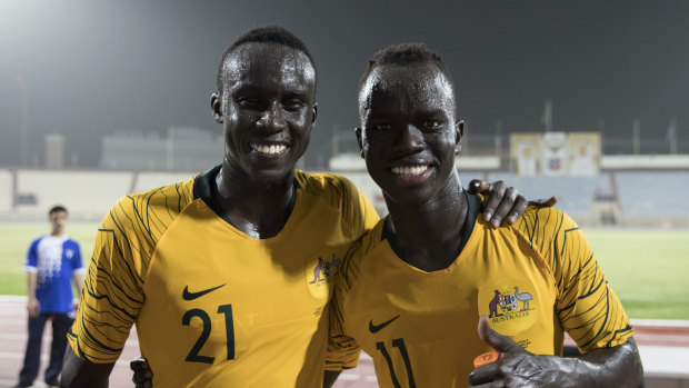 Awer Mabil (right), with Socceroos teammate Thomas Deng.