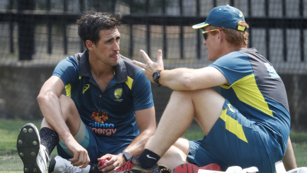 Andrew McDonald chats with Mitchell Starc during training for the Boxing Day Test.