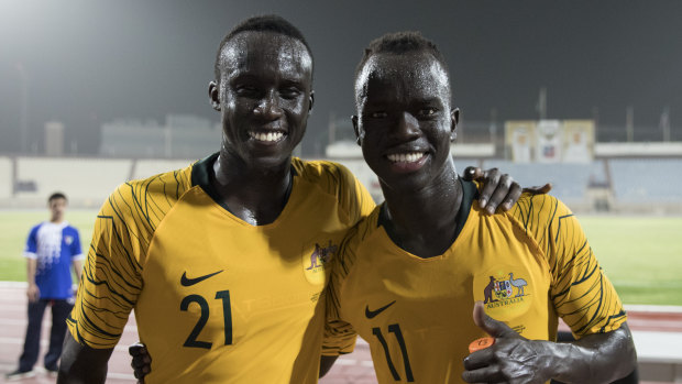 Thomas Deng (left), 21, debuted for the Socceroos alongside childhood friend Awer Mabil last year.