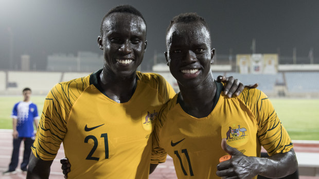 Thomas Deng (left) debuted for the Socceroos alongside childhood friend Awer Mabil last year.