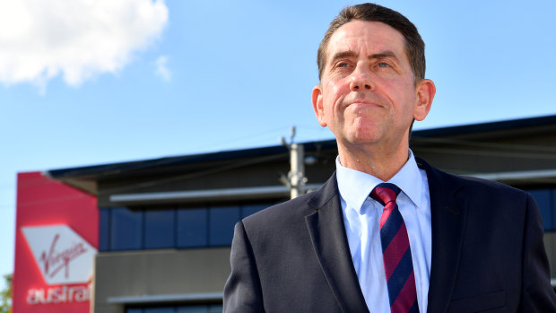 Queensland Treasurer Cameron Dick outside Virgin Australia headquarters at Bowen Hills in Brisbane.