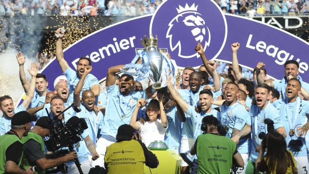 Big chance to repeat: Manchester City players lift the English Premier League trophy.