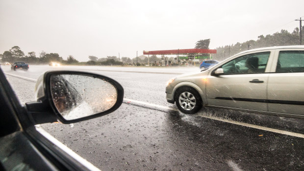 Rain forced cars to pull over on the the Bass Highway, near Koo Wee Rup.