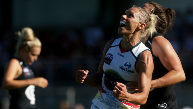 Erin Phillips of the Crows celebrates on the final siren.
