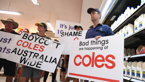 Queensland dairy farmers protesting inside a Coles supermarket last week. 