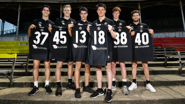 Blue recruits: Carlton's latest pick-ups show off their new numbers.
