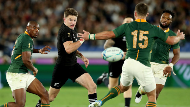 Tweaking tactics: Beauden Barrett puts in a short kick behind the rushing South African defence.