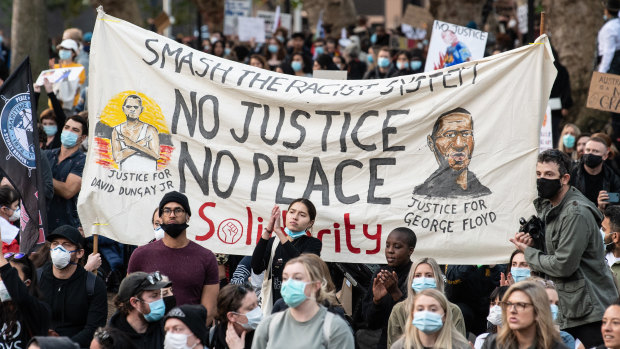 A Black Lives Matter rally in Sydney, where protesters held a banner for both George Floyd in the US and David Dungay jnr in Australia. 
