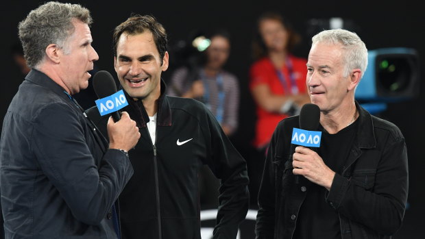 Actor Will Ferrell and John McEnroe conducting a post match interview with Roger Federer at 2018's Australian Open.