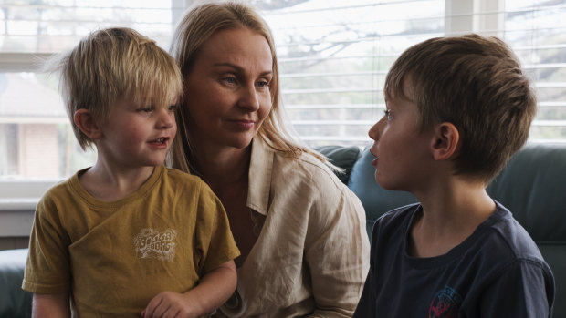 Sandy Smith and two of her four boys - Emmett (8) and Reid (4) at their family home in Austinmer.  Sandy Smith's husband Kurt took his own life in April 2017. 