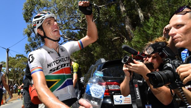 Champion again: Daryl Impey celebrates after stage six of the Tour Down Under from McLaren Vale to Willunga Hill.