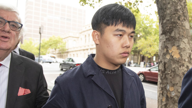 Alleged cat thrower Cheng Lu leaves the Melbourne Magistrates Court on Monday.