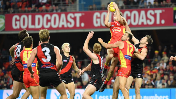 Up and about: Ben King marks in front of goal for the Gold Coast Suns.