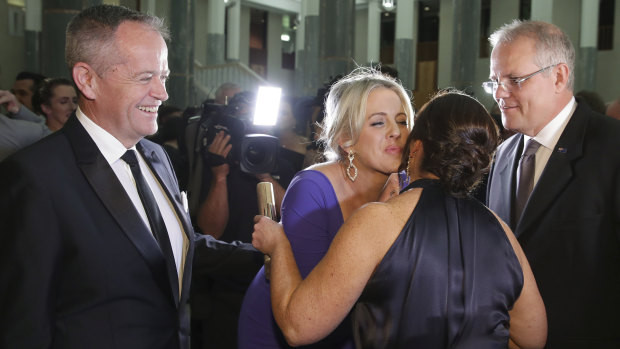 Opposition Leader Bill Shorten and Chloe Shorten with Prime Minister Scott Morrison and Jenny Morrison as they arrive for the Mid Winter Ball.