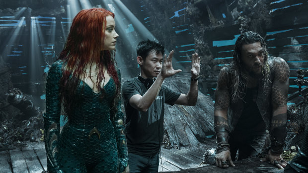 James Wan directs Amber Heard and Jason Momoa on the Queensland set of the movie.
