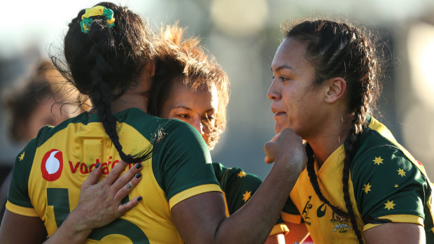 Dominant: Mhicca Carter scores a try for the Wallaroos.