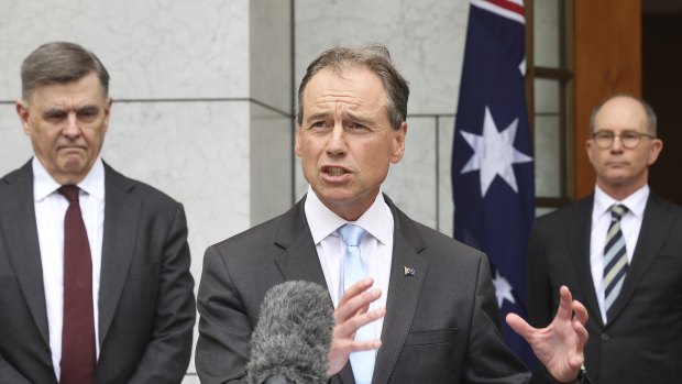 Secretary of the Department of Health Professor Brendan Murphy, Health Minister Greg Hunt and Chief Medical Officer Professor Paul Kelly  during a press conference on the COVID-19 vaccine road map on Thursday. 