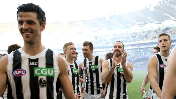 Happy days: The Magpies leave the field in Perth.
