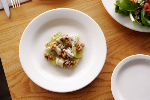 Braised leeks with blue cheese and walnuts.