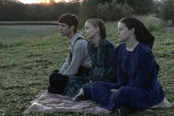 Ben Whishaw, from left,  Rooney Mara and Claire Foy in Women Talking, which is adapted from Miriam Toews’ best-selling book of the same name. 