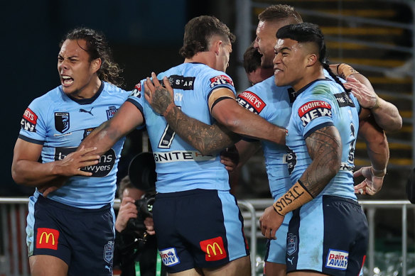 The Blues celebrate Jack Wighton’s try.