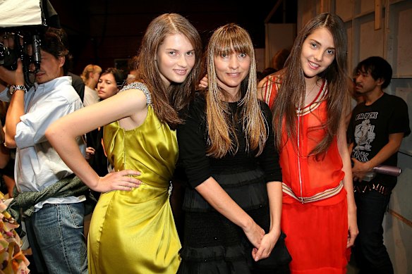 Dinnigan (centre) with models in Paris at her fashion week show in October 2007.