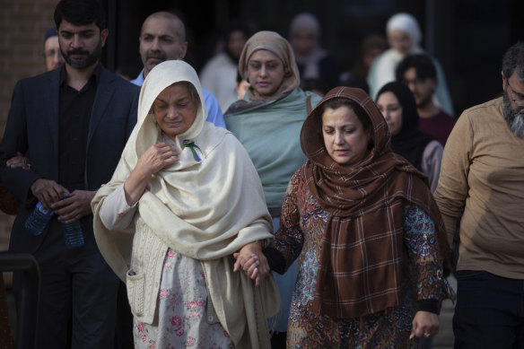 Family and friends of the Afzaal family, including Tabinda Bukhari, front-left, the mother of Madiha Salman, exit the Superior Court of Justice in Windsor Canada after the verdict.