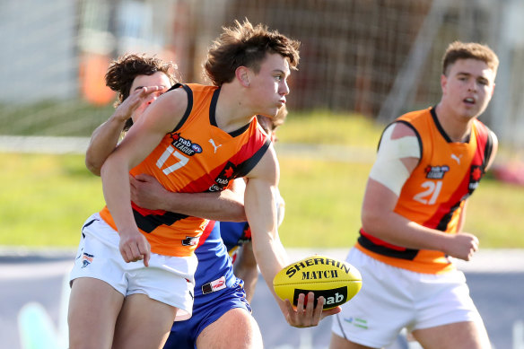 Harry Rowston handballs during a NAB League match between Eastern Ranges and Calder Cannons.