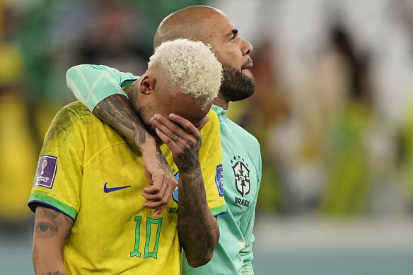 Brazil’s Neymar reacts after the penalty shootout besides Brazil’s goalkeeper Ederson.