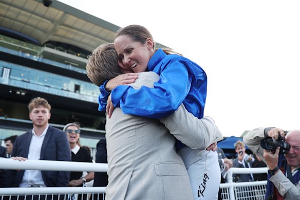 Rachel King and Bjorn Baker embrace.