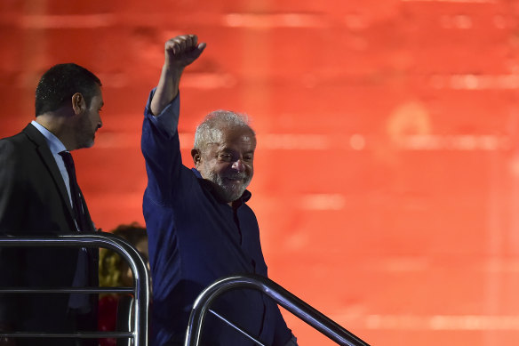 Luiz Inácio Lula da Silva waves supporters after being elected president.