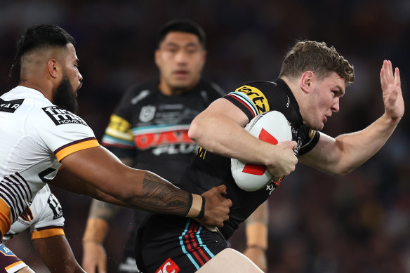 Liam Martin tries to break through the Broncos line.