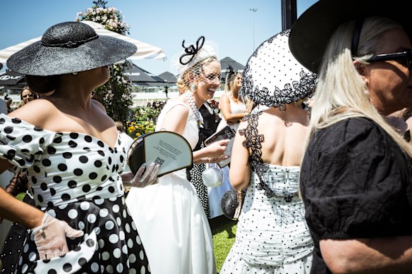 People gather to watch Fashions on the Field