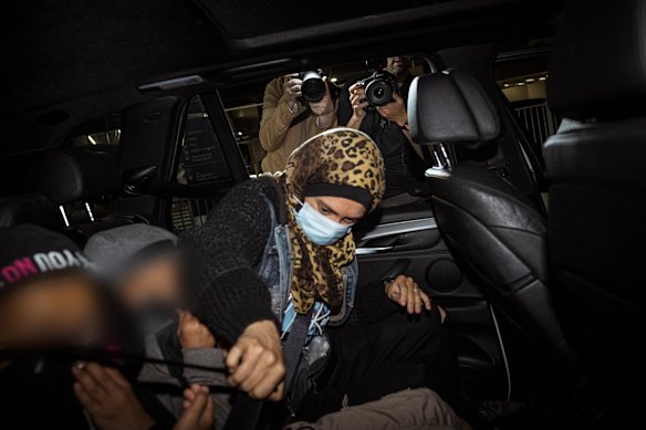 Islamic State-linked woman Kirsty Rosse-Emile gets into a car after arriving at Melbourne Airport this evening.