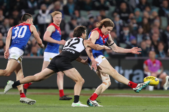 Ben Brown gets a kick away for Melbourne.