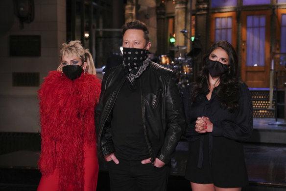 Elon Musk with Miley Cyrus and Cecily Strong during Saturday Night Live promotions earlier in the week. 