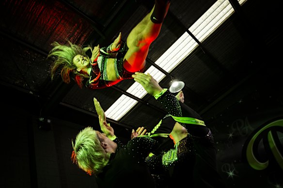 Pure Allstars Prodigy cheerleading team member Ciara Heffernan is flipped by teammates during practice.