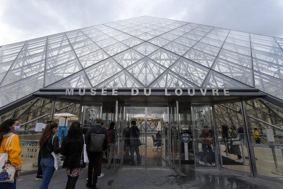 Visitors queue outside the Louvre Museum at Louvre, Paris, last week, as France begins to open up after a national lockdown.