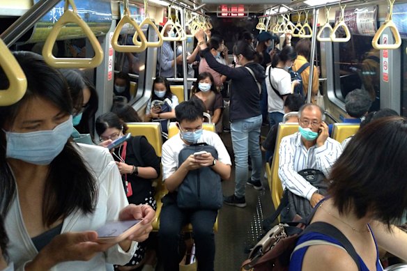 Commuters go about their normal day in Taipei. Taiwan used contact tracing and years of pandemic rehearsals as the main weapons against COVID-19, avoiding the need for restrictions.