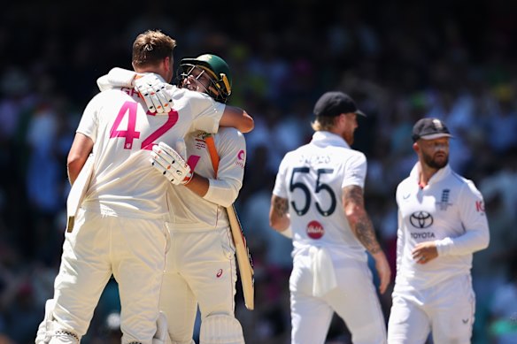 Alex Carey celebrates Ashes victory with Cameron Green.