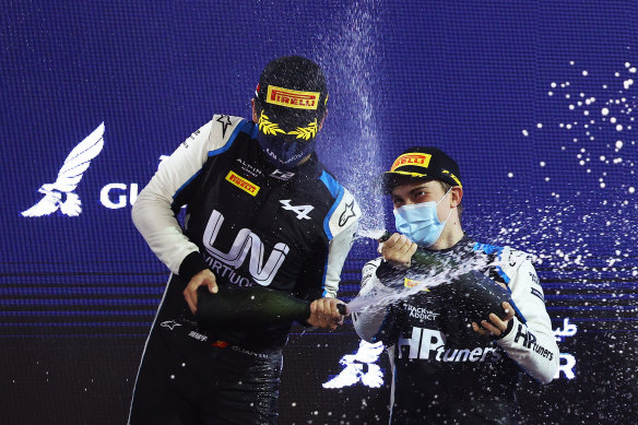Oscar Piastri celebrates his win in race two of the opening round of the F2 championship with second-placed Guanyu Zhou of China at the Bahrain International Circuit on Saturday.