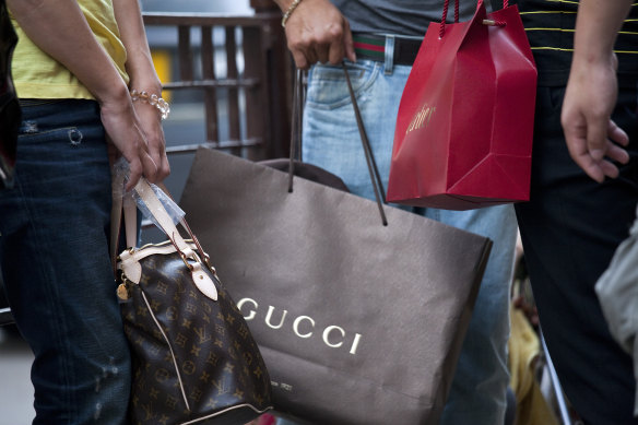 Luxury brands such as Gucci and Cartier have pocketed millions in JobKeeper while hiking their profits.